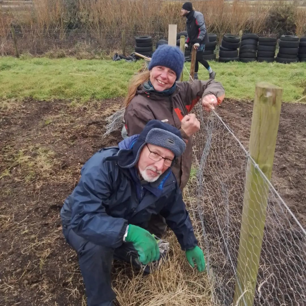 Participants from the Bosavern Training & Work Experience project working on a fence